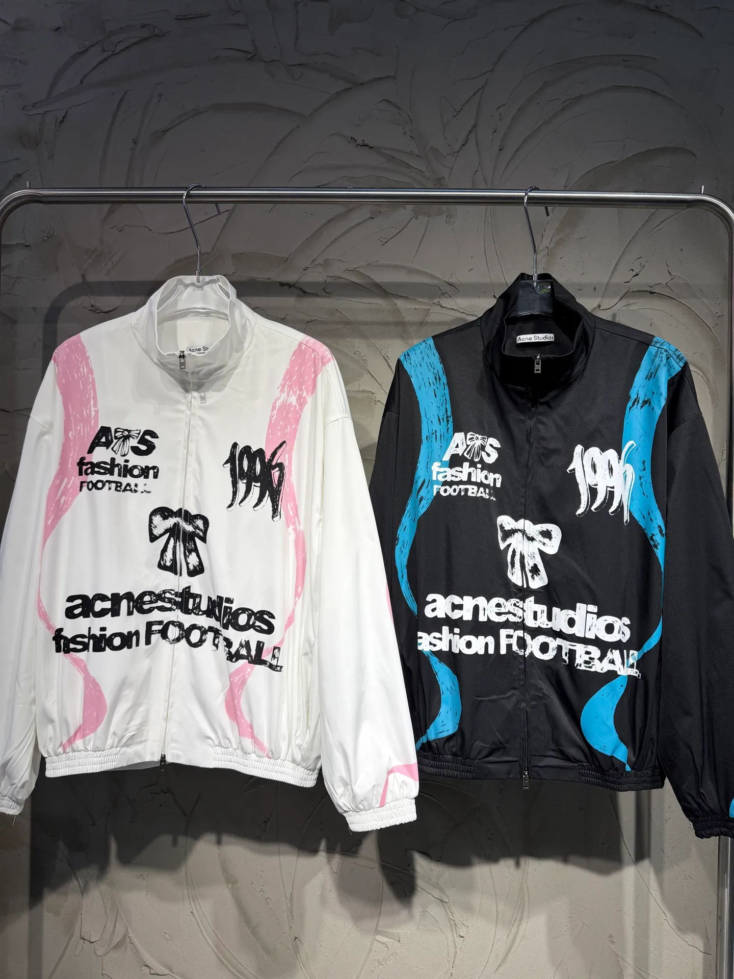 Acne studios World Cup Fashion Football Series Capsule Jacket Printed Jacket A capsule Series full of fun. Doodles, sketches and handwriting are all transformed into intentional designs. Imperfect lines and intuitive brushstrokes create a sense of reality, like a signed jersey or a message in the locker room. Each item carries a story, a memory, and a signature. Size: SML Color: Black, White